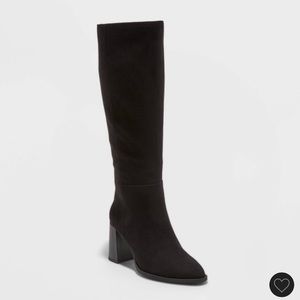 woman’s tall knee length black boots